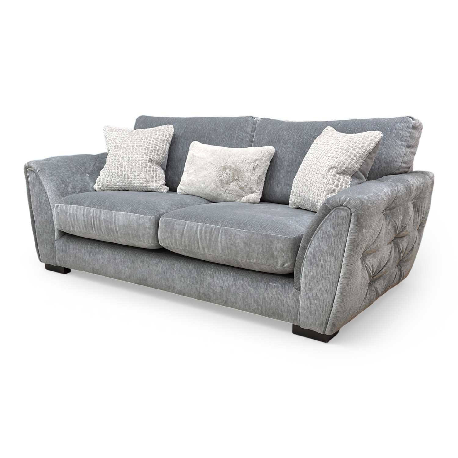 Side profile of the 'Aphrodite' sofa, highlighting the luxurious fabric and deep seating design.