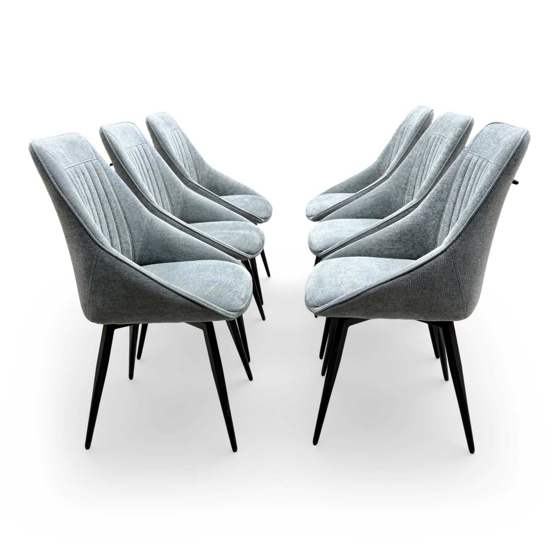 Side profile of the 'Crete' swivel chair showing the ergonomic back curvature and slender metal frame.