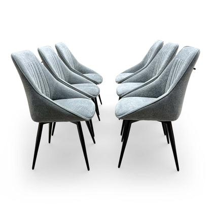 Side profile of the 'Crete' swivel chair showing the ergonomic back curvature and slender metal frame.