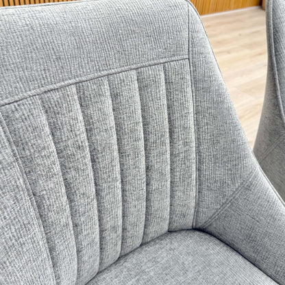 Close-up of the premium dark grey fabric texture and detailed stitching on the 'Crete' cushioned seat.