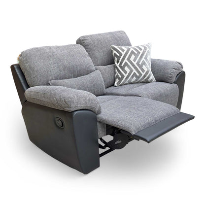 Front view of the 'Santori' 2-seater sofa in charcoal fabric, featuring a high back and manual recliner.