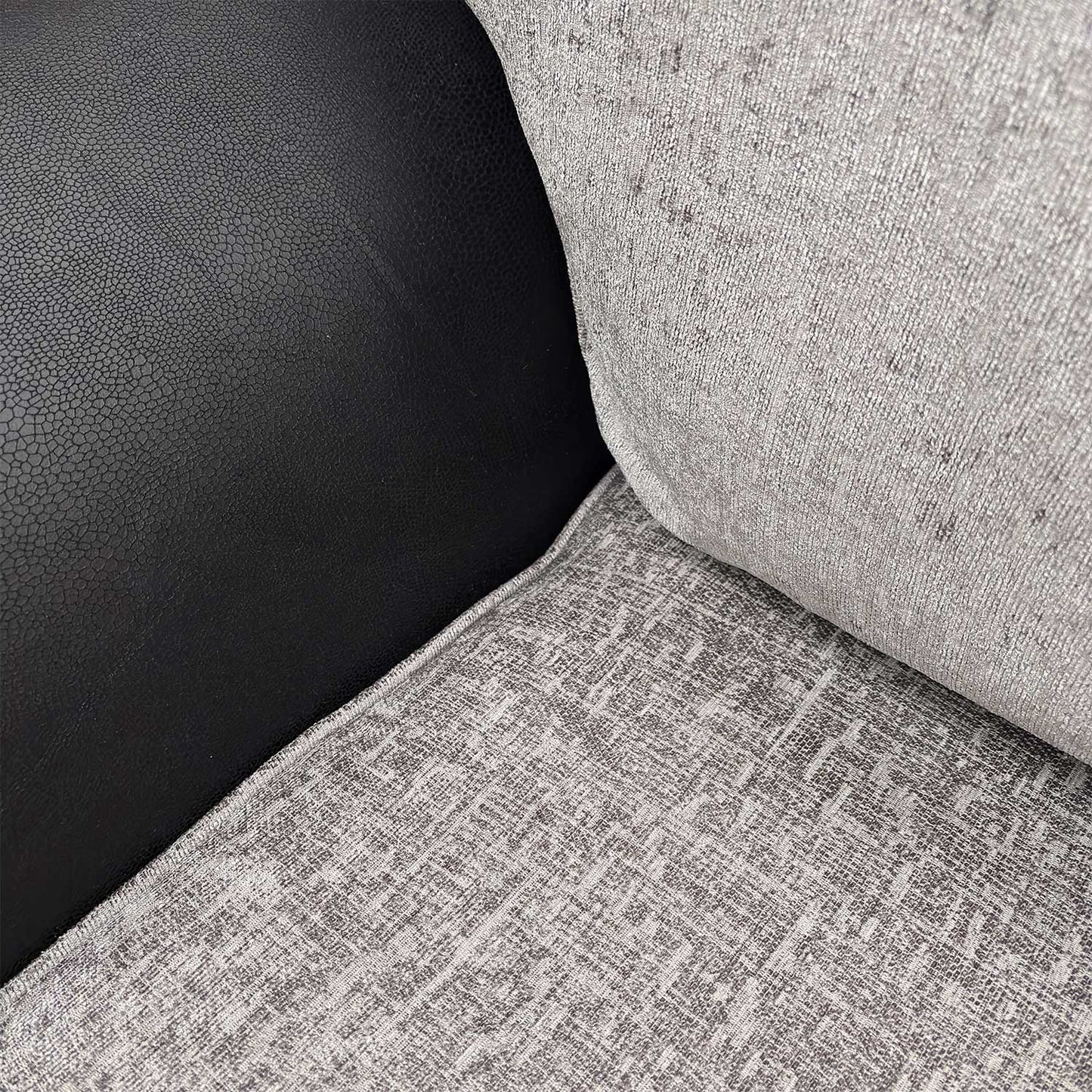 Detailed close-up of the grey fabric mix on the Marino’ sofa, illustrating the tactile depth and high-quality textile finish.
