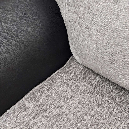 Detailed close-up of the grey fabric mix on the Marino’ sofa, illustrating the tactile depth and high-quality textile finish.
