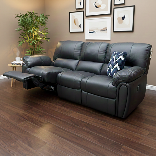 Living Room shot of the ‘Leighton’ black leather and faux leather sofa, highlighting the luxurious padded cushions and modern style.