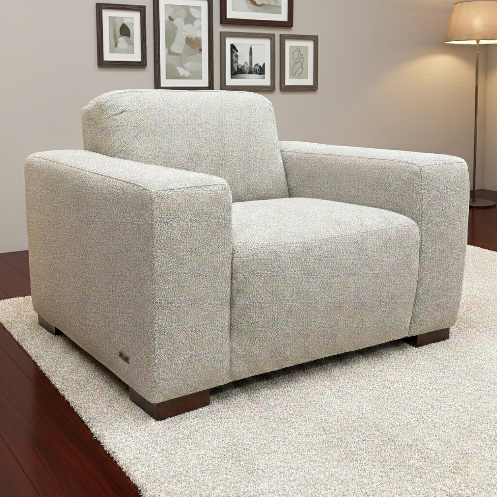 Living Room shot of the ‘Cortes’ natural fabric armchair, highlighting its structured silhouette and neutral tone