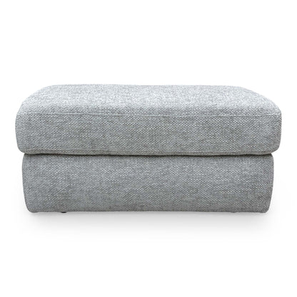 Front view of the Very ‘Avena’ footstool in soft grey fabric, featuring a clean rectangular design and subtle stitching.