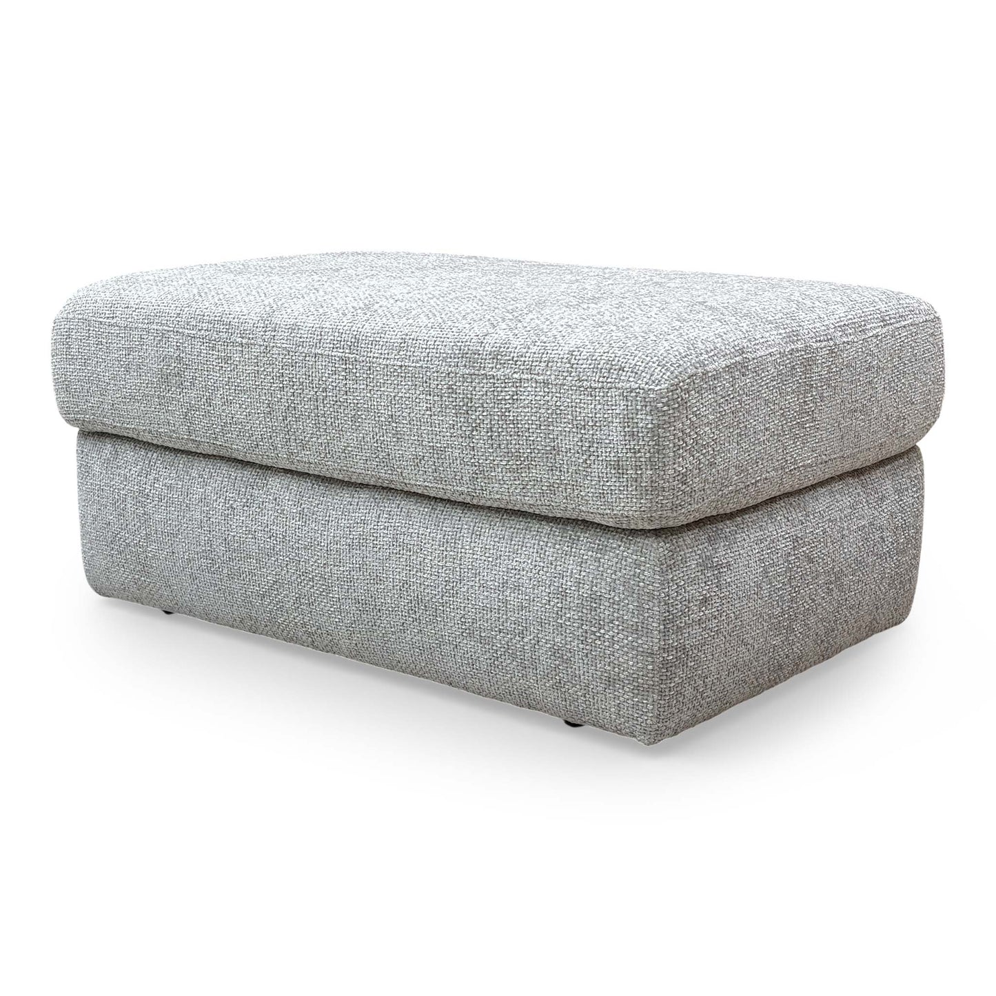 Side view of the ‘Avena’ footstool, showcasing the sleek profile and professional upholstery finish.
