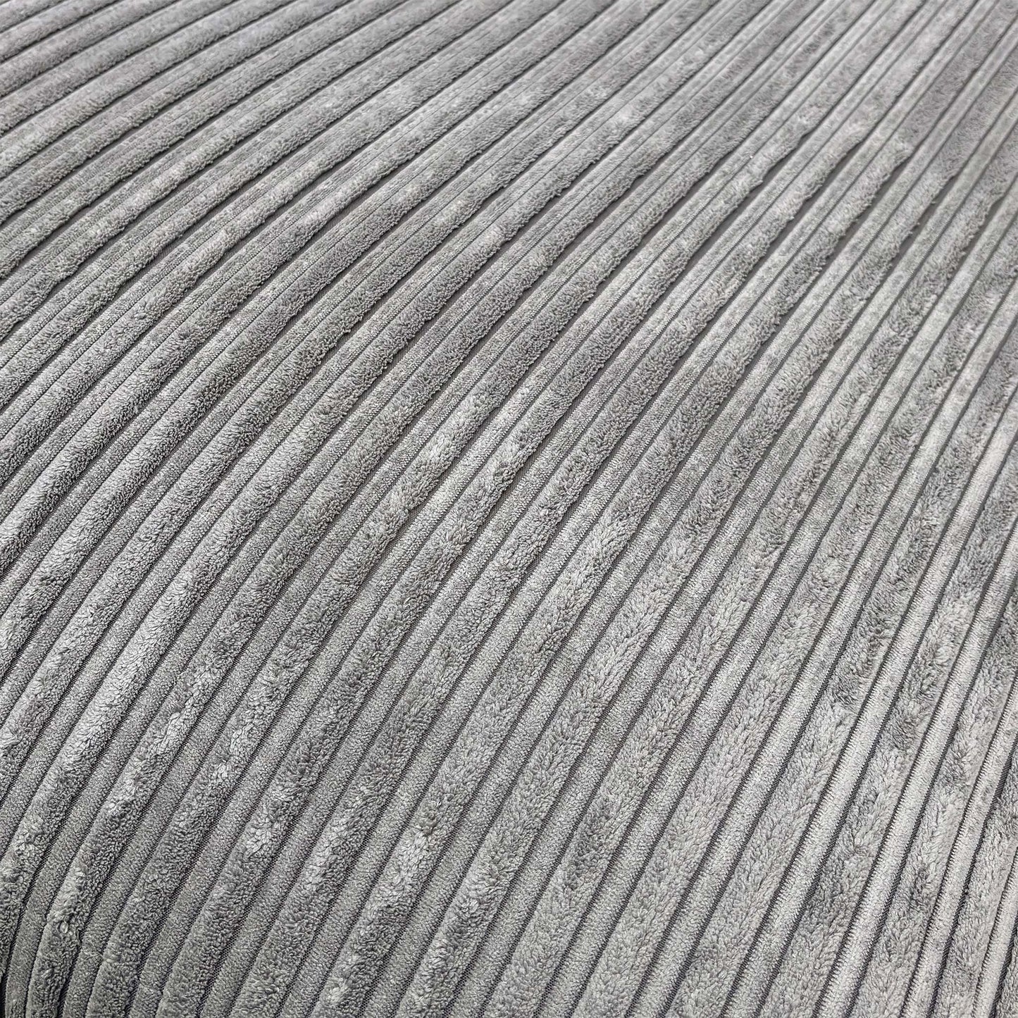 Detailed close-up of the charcoal cord fabric on the ‘Amalfi’ sofa, illustrating the durable ribbed texture and quality stitching.