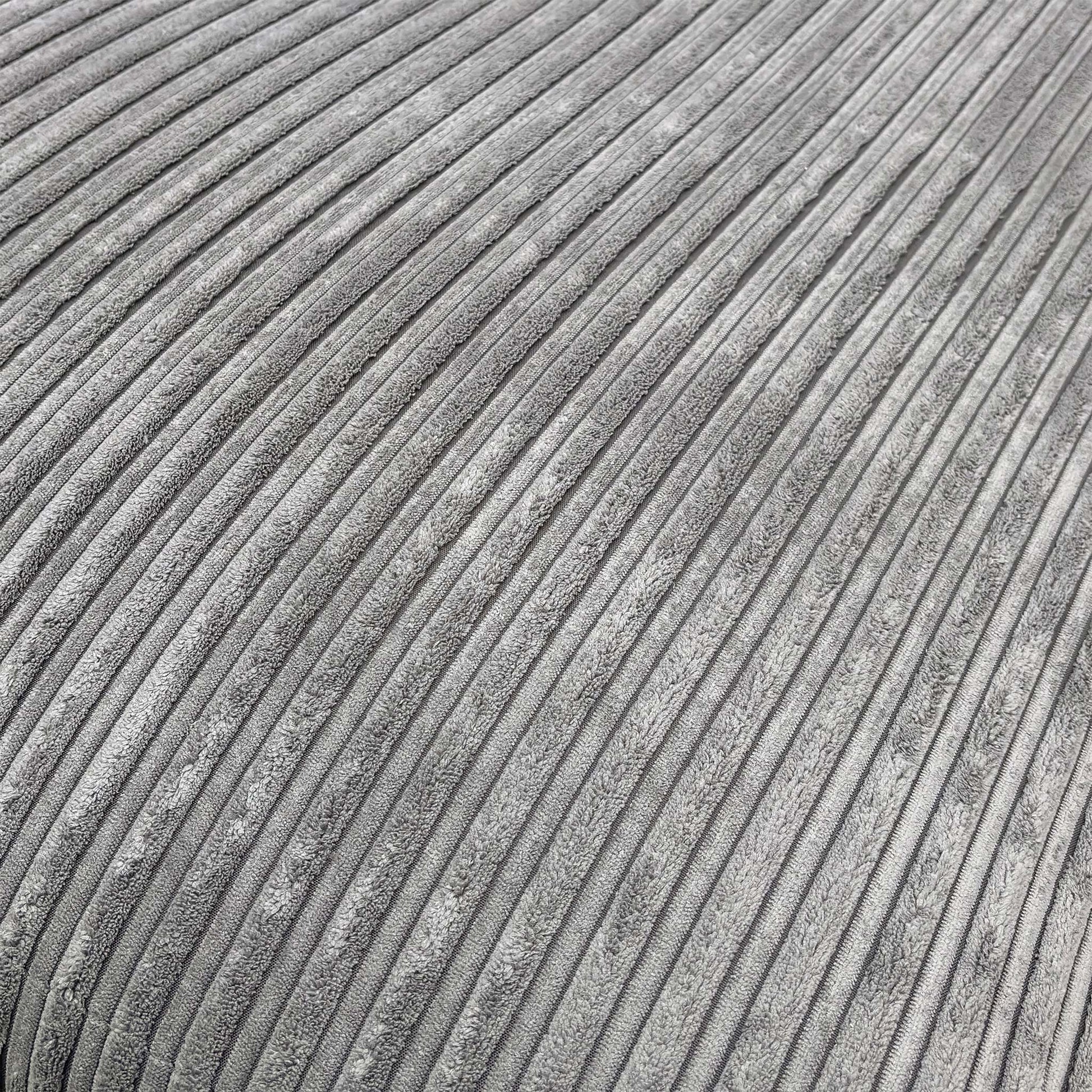 Detailed close-up of the charcoal cord fabric on the ‘Amalfi’ sofa, illustrating the durable ribbed texture and quality stitching.