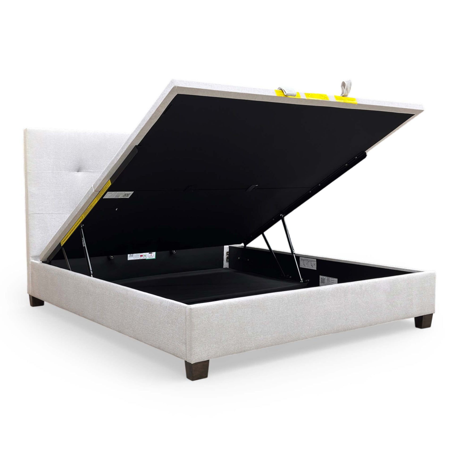 Interior view of the ottoman storage compartment, emphasizing the depth and utility for storing bedding and linens.