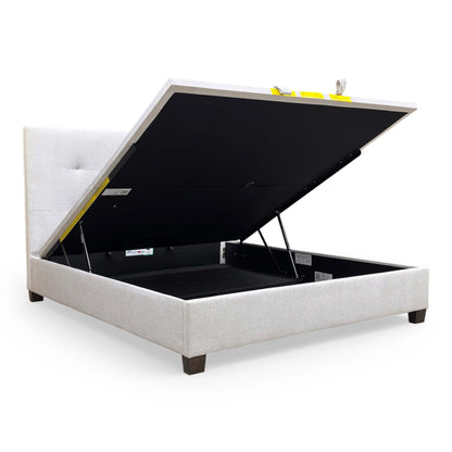 Interior view of the ottoman storage compartment, emphasizing the depth and utility for storing bedding and linens.