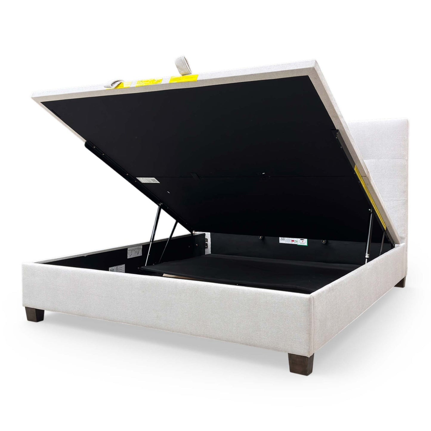 Interior view of the ottoman storage compartment, emphasizing the depth and utility for storing bedding and linens.