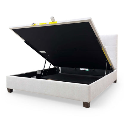 Interior view of the ottoman storage compartment, emphasizing the depth and utility for storing bedding and linens.