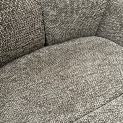 Detailed shot of the premium ash grey textured upholstery fabric and high-quality stitching.