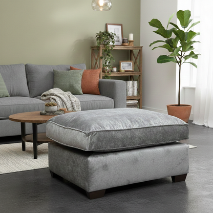 Living Room view of the Kingston grey fabric footstool, highlighting the generous seating surface and soft texture.