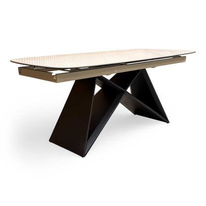 Side profile of the Oasis dining table, showcasing the slim tabletop profile and the sturdy central support column.