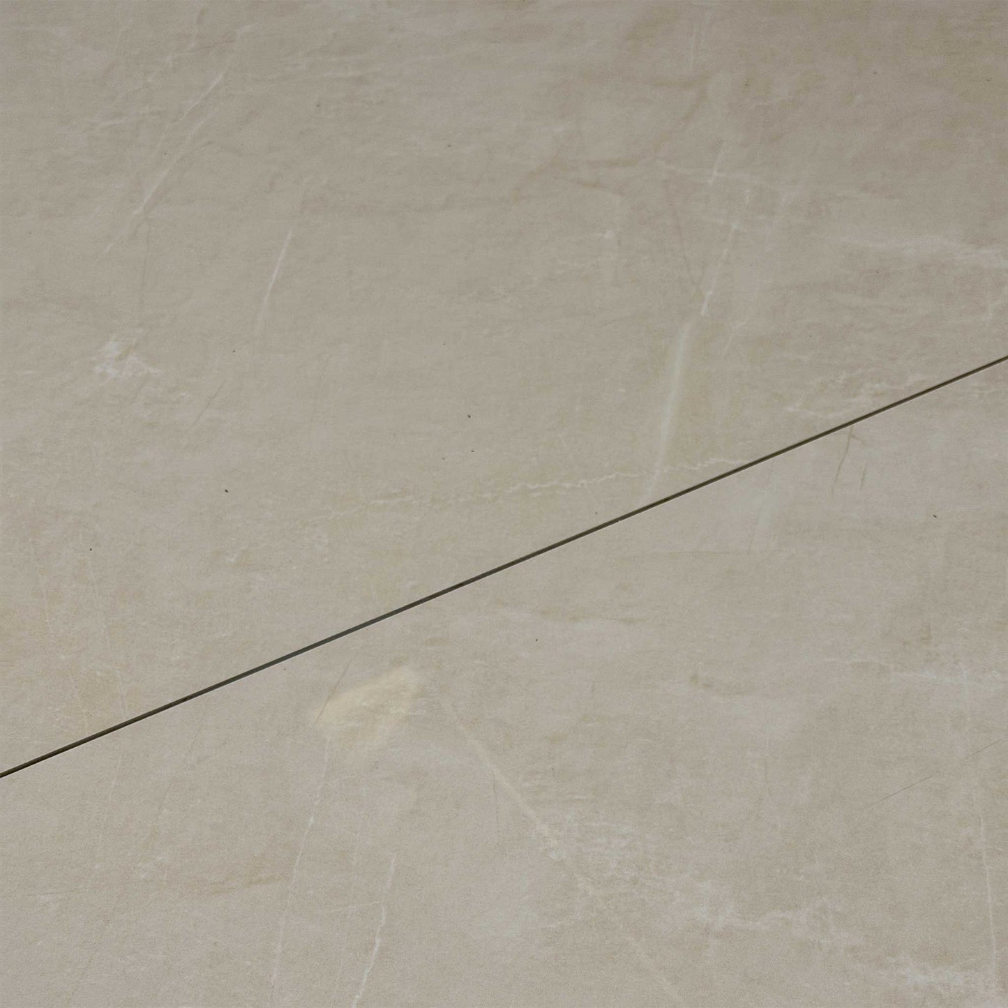 Detailed close-up of the white ceramic tabletop, showcasing the elegant marble-style texture and durable, scratch-resistant finish.