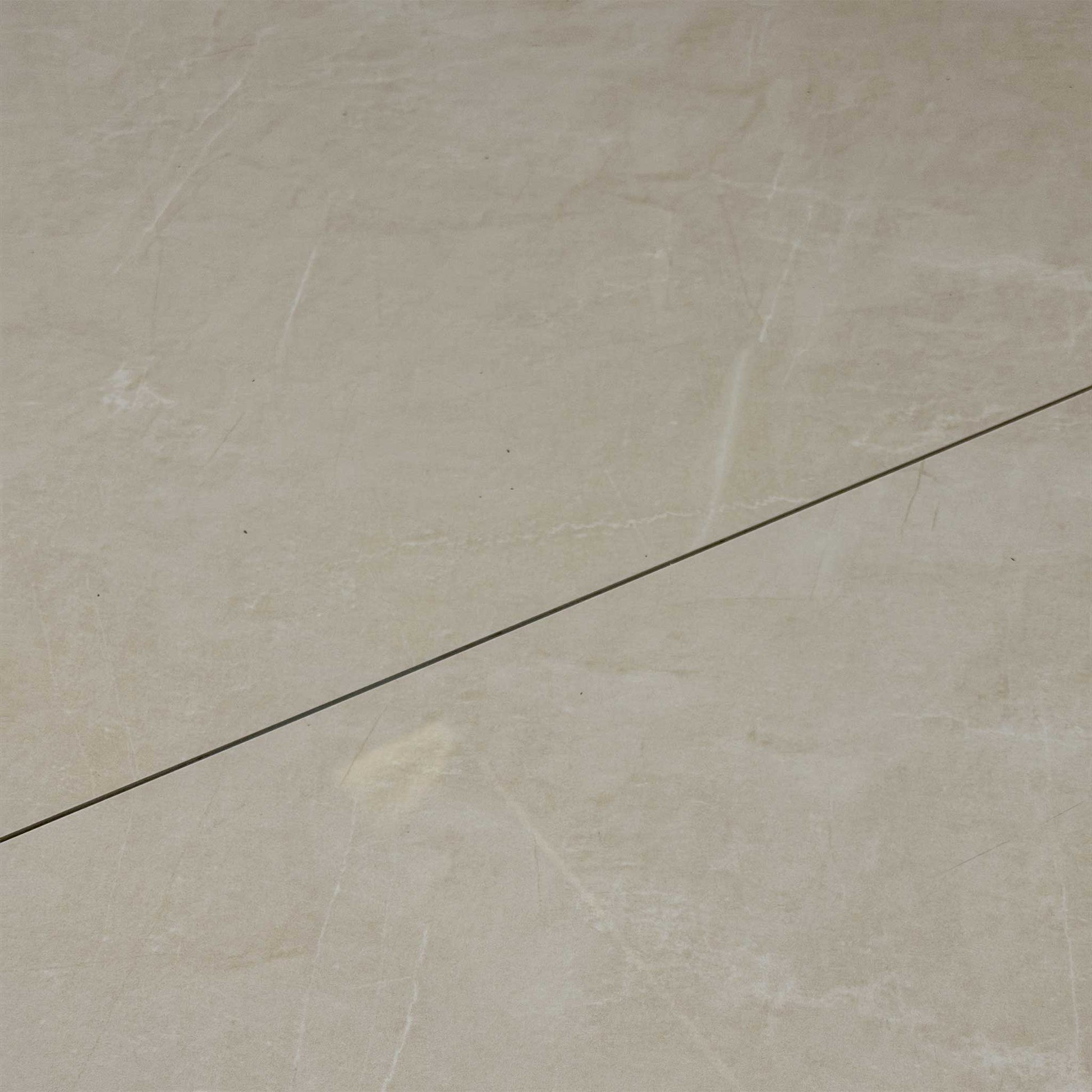 Detailed close-up of the white ceramic tabletop, showcasing the elegant marble-style texture and durable, scratch-resistant finish.
