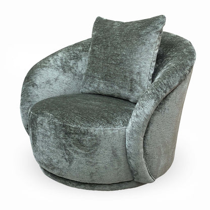 Side profile of the ‘Jasper’ accent chair showing the elegant sloping arms and sturdy structural design.