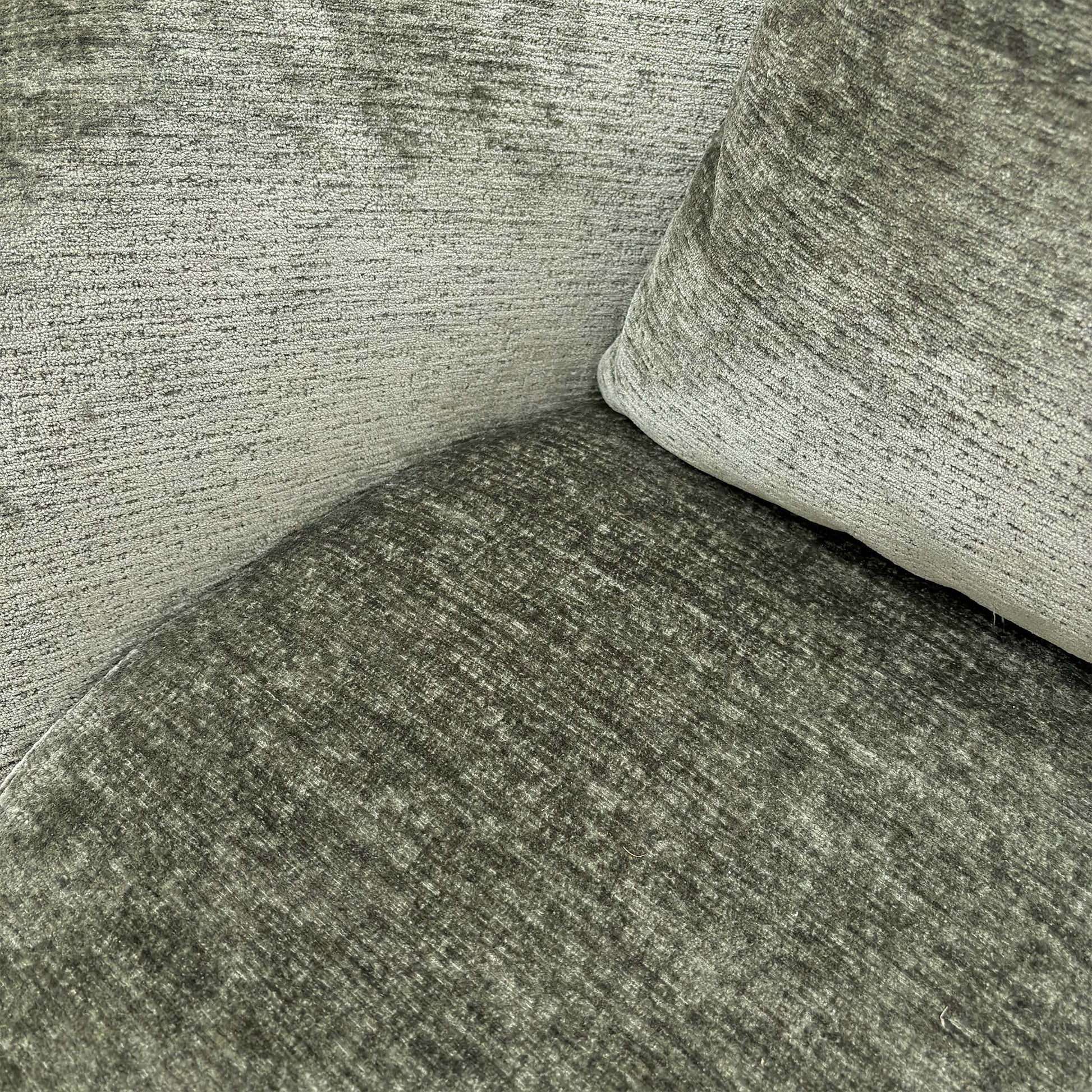 Close-up shot of the high-quality moss green chenille fabric, emphasizing the soft, textured weave.
