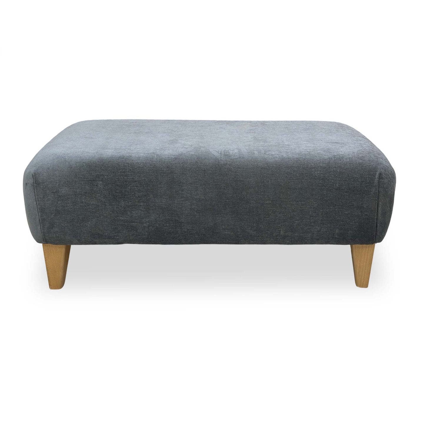 Side profile of the Garda footstool showing the low-block feet and clean contemporary silhouette.