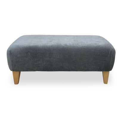 Side profile of the Garda footstool showing the low-block feet and clean contemporary silhouette.