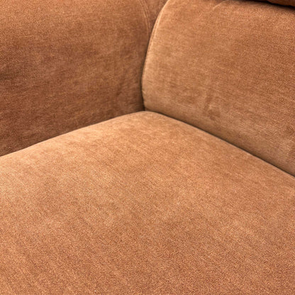 Close-up of the seating area showing the luxurious texture of the R500 caramel fabric.