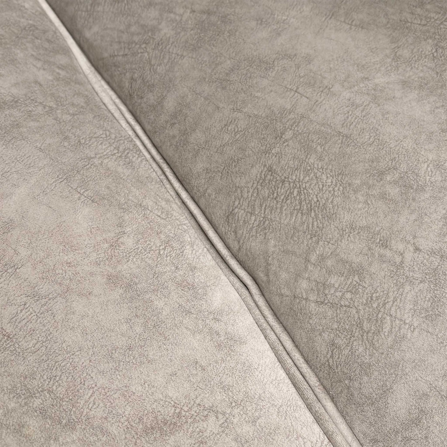 Close-up of the dapple velvet upholstery, emphasizing the luxurious cream texture and weave.