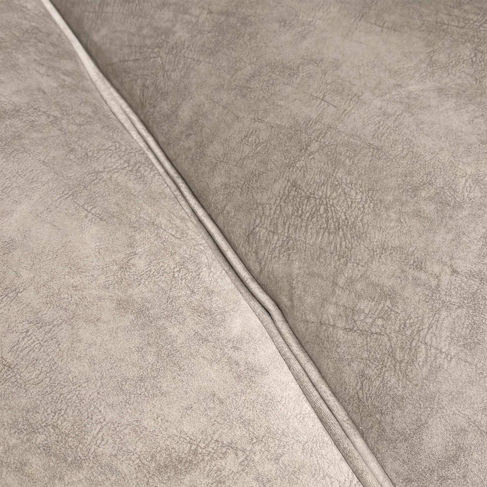 Close-up of the dapple velvet upholstery, emphasizing the luxurious cream texture and weave.