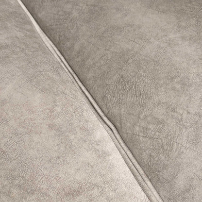 Close-up of the dapple velvet upholstery, emphasizing the luxurious cream texture and weave.