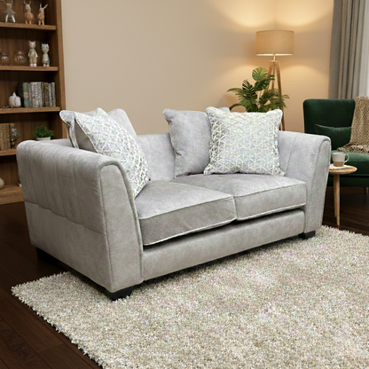 Living Room view of the cream dapple velvet 2-seater sofa, highlighting the textured fabric and curved arms.