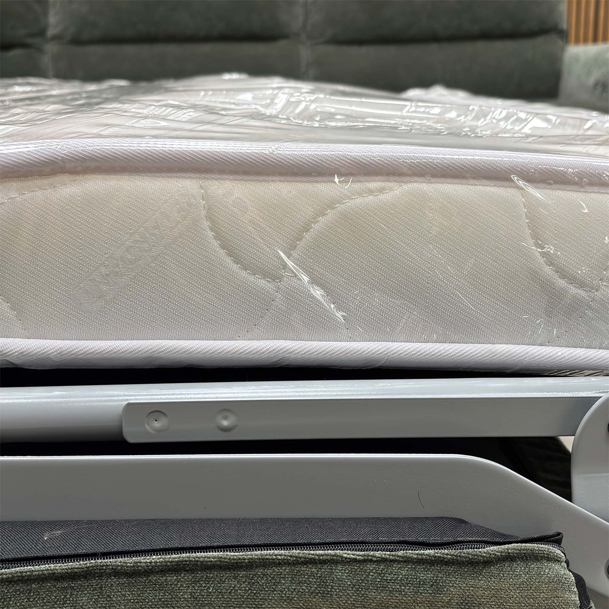 View of the sofa converted into a large double bed with a high-quality foam mattress.