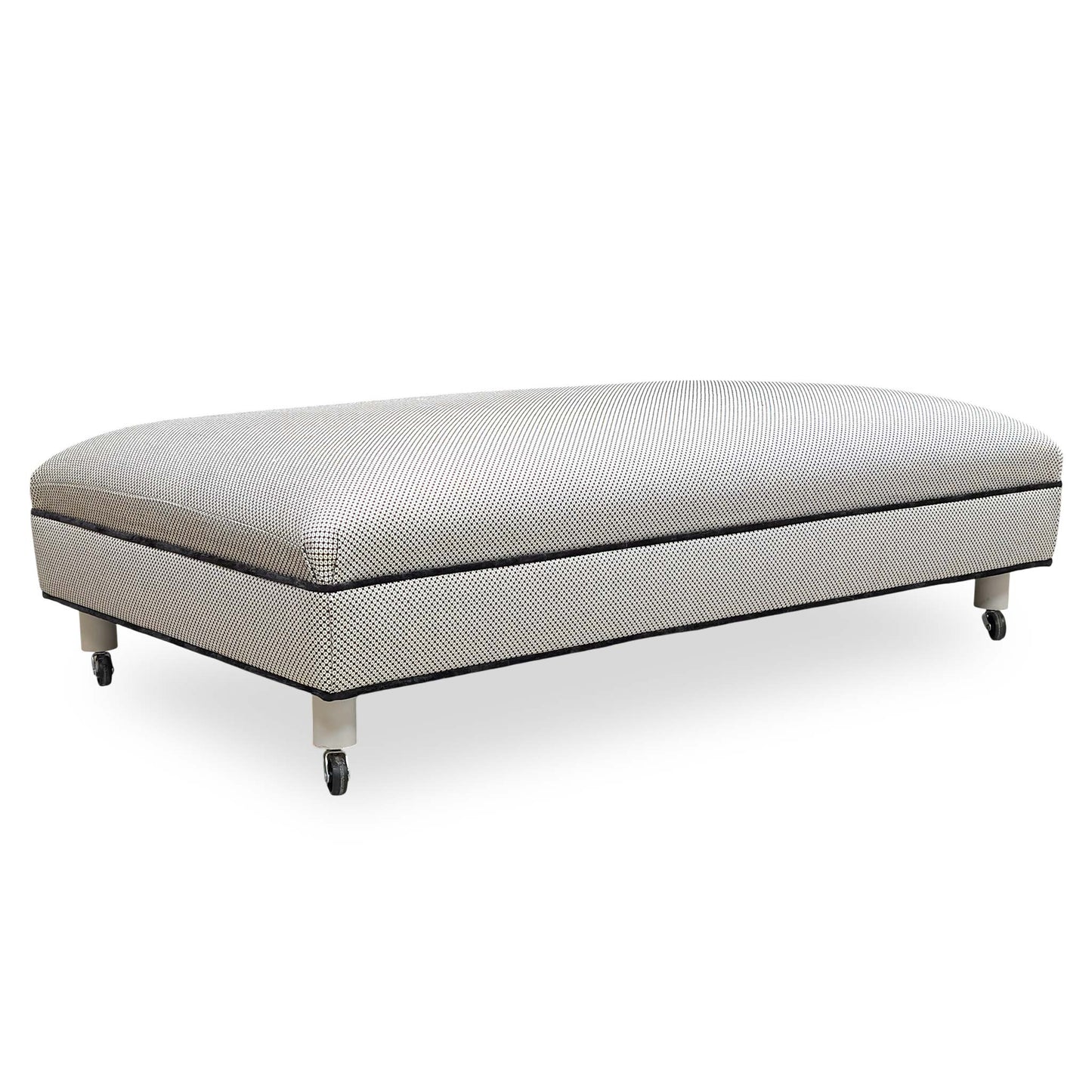 Front angle view of the Furniture Village ‘Ambassador’ Allure Noir Eby Ft fabric footstool in a deep charcoal finish.