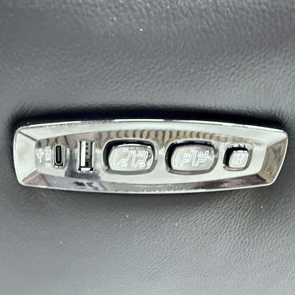Close-up of the sleek integrated power control buttons and USB charging port on the side of the ‘Xavier’ sofa.