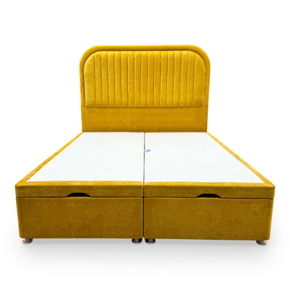Front view of the Highgrove ‘Portland’ King Bed featuring a tall, floor-standing Aston Saffron yellow fabric headboard and a matching ottoman divan base.