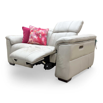Side profile of the ‘Inca’ sofa with one seat fully extended, showcasing the space-saving recliner motion.