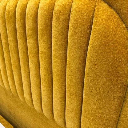 Close-up of the Aston Saffron fabric, showcasing the rich yellow tone and premium woven texture of the bed set.