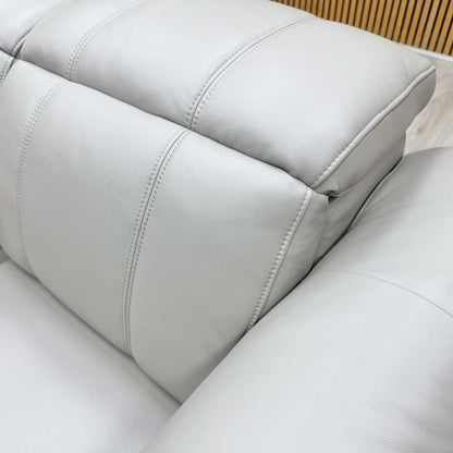 Detailed texture shot of the high-quality Cat-60/23 lead grey leather upholstery and stitching.