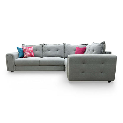 Side view of the Goliath corner sofa showcasing the clean silhouette and uniform fabric coverage.
