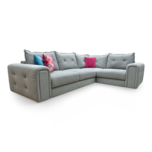 Full view of the ‘Goliath’ Oxford Grey right-hand facing corner sofa featuring plush pillow-back cushions.