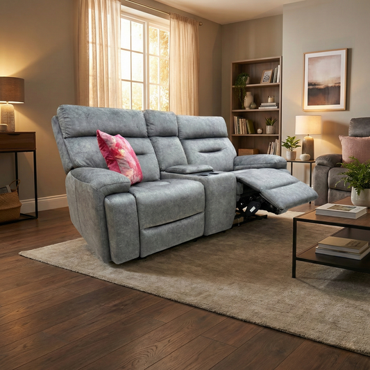Living room shot showing the Cinemax sofa in a darkened home cinema setting, highlighting the integrated speaker system.