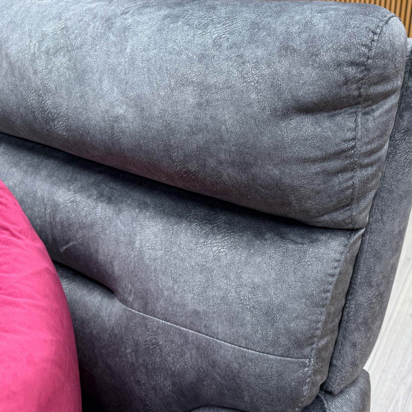 Close-up of the plush marble dark grey velvet fabric and high-quality stitching detail.