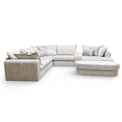 Side view of the Savoy 3 corner sofa showcasing the deep chaise sections and sleek gold trim along the base.