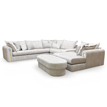 Angle view of the large designer footstool with marble-effect upholstery and matching gold trim base.