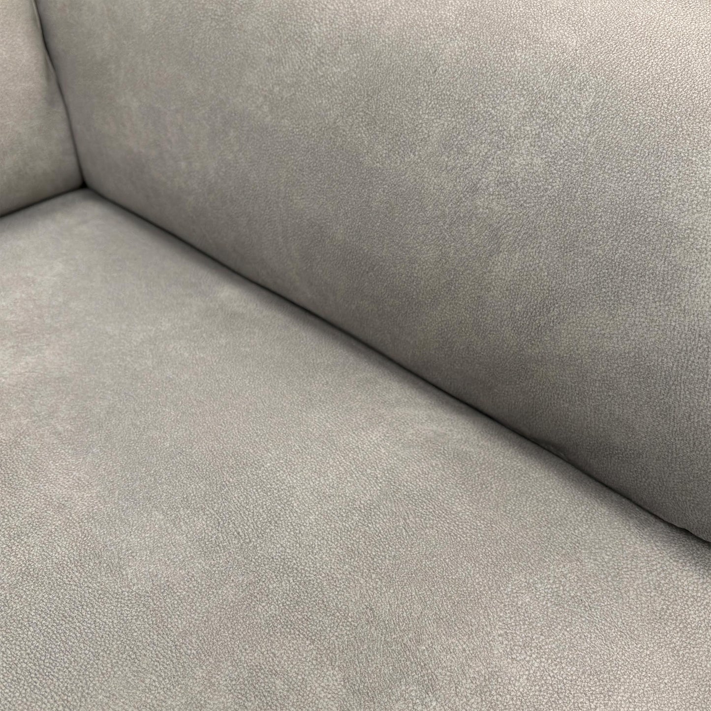 Detailed shot of the high-quality Dexter Stone 43502 velvet upholstery and textured fabric finish.