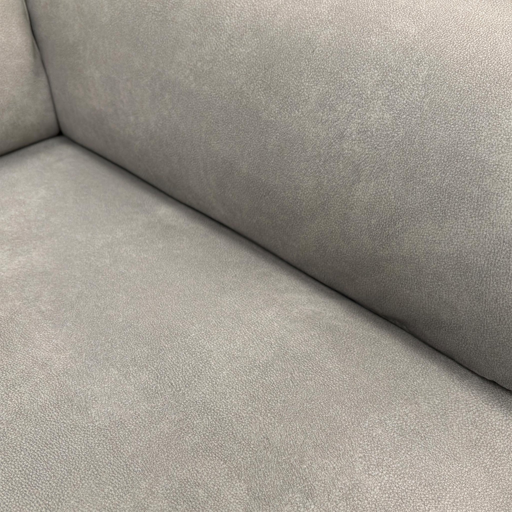Detailed shot of the high-quality Dexter Stone 43502 velvet upholstery and textured fabric finish.
