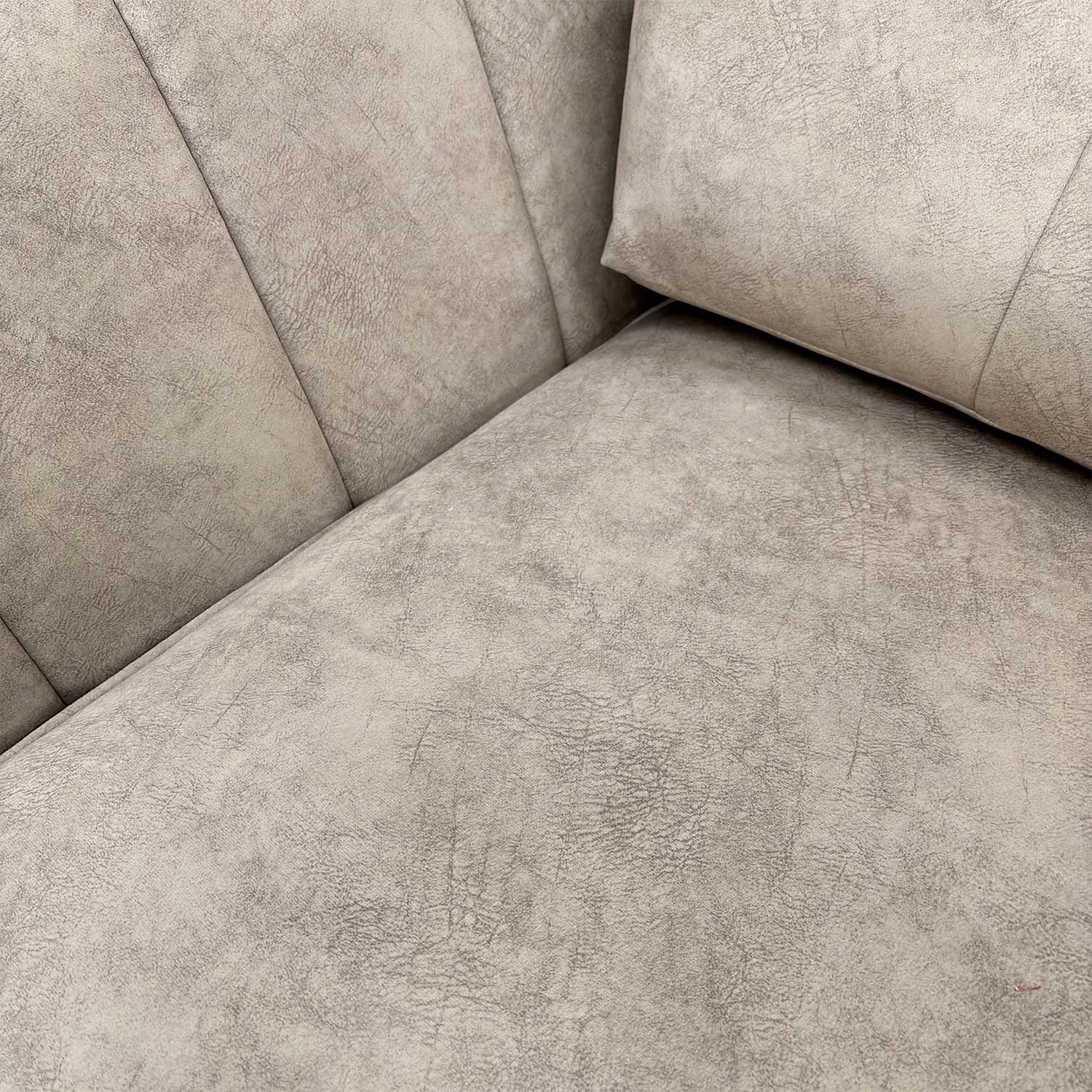 Close-up of the luxurious dapple cream velvet upholstery and high-quality stitching detail.