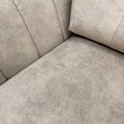 Close-up of the luxurious dapple cream velvet upholstery and high-quality stitching detail.