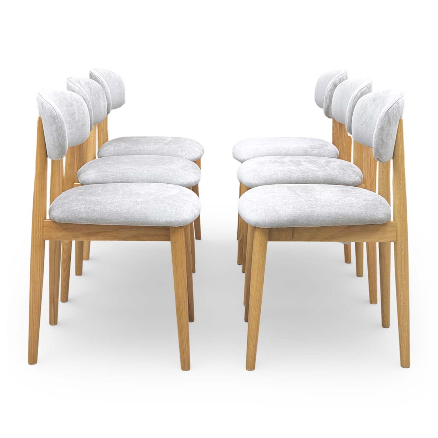 Side profile of the Stockholm chair showing the sleek contemporary silhouette and tapered wooden legs.