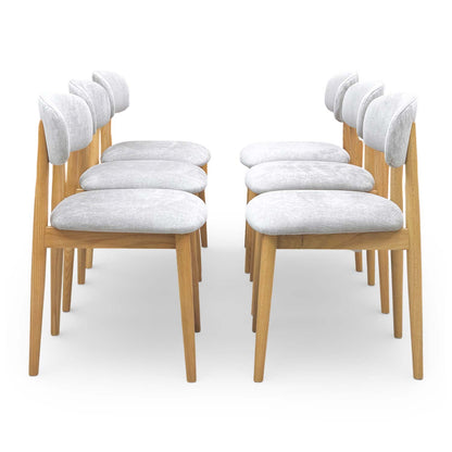 Side profile of the Stockholm chair showing the sleek contemporary silhouette and tapered wooden legs.